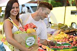 Couple shopping at open street market.