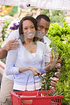 Couple shopping in produce section