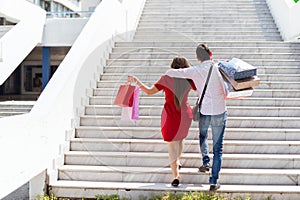 Couple while shopping and spending money