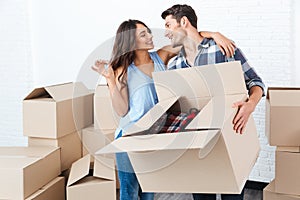 Couple showing keys to new home