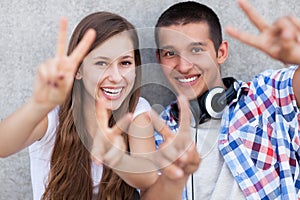 Couple showing peace sign