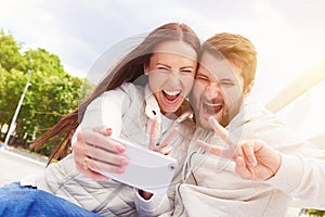 Couple showing peace sign