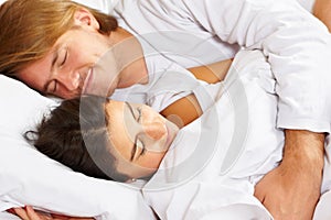 Couple showing romance on bed