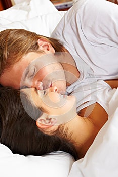 Couple showing romance on bed