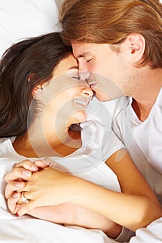 Couple showing romance on bed