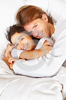 Couple showing romance on bed