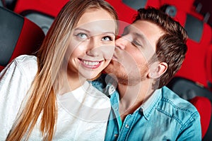 Couple showing their feelings in cinema