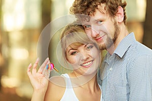 Couple showing their new house keys