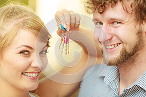 Couple showing their new house keys