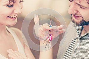 Couple showing their new house keys