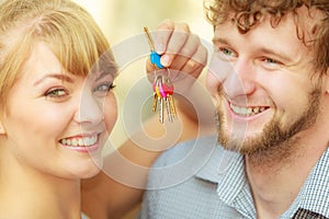 Couple showing their new house keys
