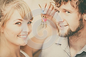 Couple showing their new house keys