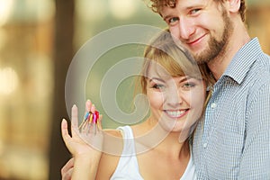 Couple showing their new house keys