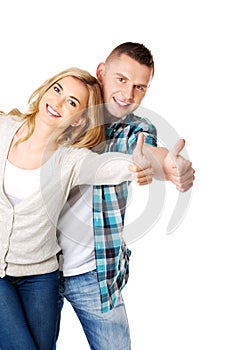 Couple showing thumbs up