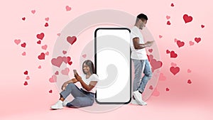 Couple showing white empty smartphone screen and texting