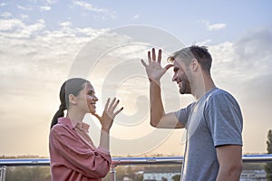 Couple showing words mother and father in the language of the deaf