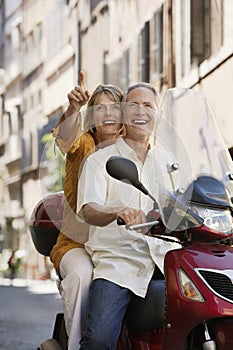 Couple Sightseeing On Scooter