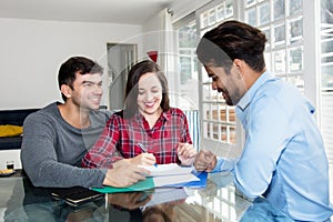 Couple signing contract for own house