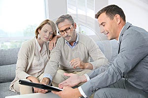 Couple signing mortgage contract