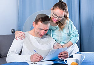 Couple signing papers