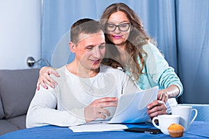 Couple signing papers