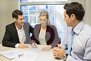 Couple signing real-estate contract