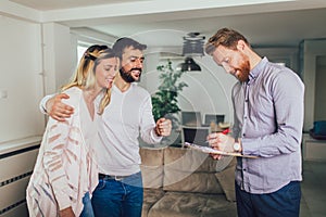 Couple signing terms of real-estate contract