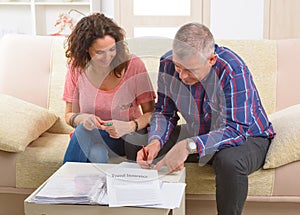 Couple signing travel insurance contract