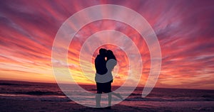 Couple, silhouette with kiss at beach and sunset, love with romance and travel outdoor with adventure in Thailand. Man