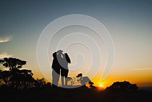 Couple silhouette at sunrise in Brazil