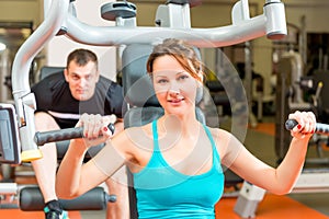 Couple on simulators in the gym