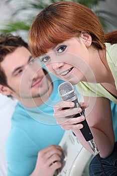 Couple singing karaoke