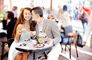 Couple sit in cafe