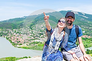 Couple sit in Mtskheta