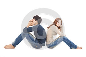 Couple sitting back to back during conflict