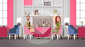 Couple sitting cafe table romantic dinner happy valentines day celebration concept young man woman love dating modern