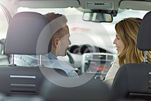 Couple sitting in a car