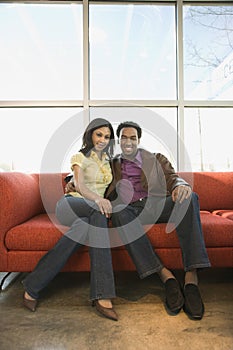 Couple sitting on couch.