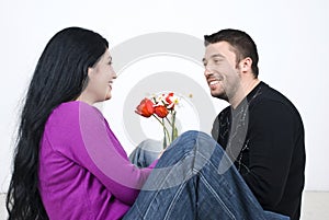 Couple sitting on floor and laughing