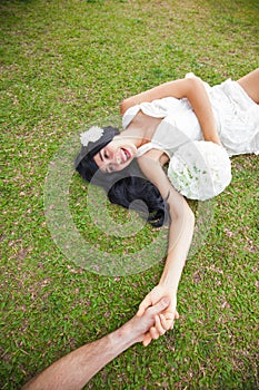 Couple sitting in garden of hotel