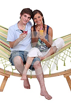 Couple sitting in a hammock