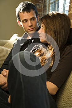 Couple sitting on sofa