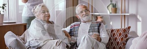 Couple sitting on the sofa in the nursing home