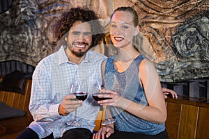Couple sitting together and having glass of wine