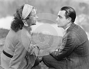 Couple sitting together and looking at each other