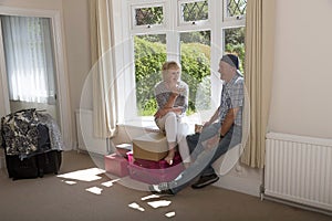 Couple sitting on a window seat