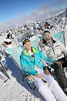 Couple of skiers enjoying the sun on the slopes