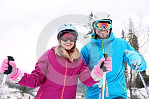 Couple of skiers on slope at resort. Winter