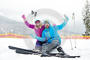 Couple of skiers on slope at resort. Winter