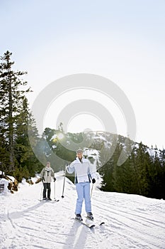 Couple Skiing Down Slope